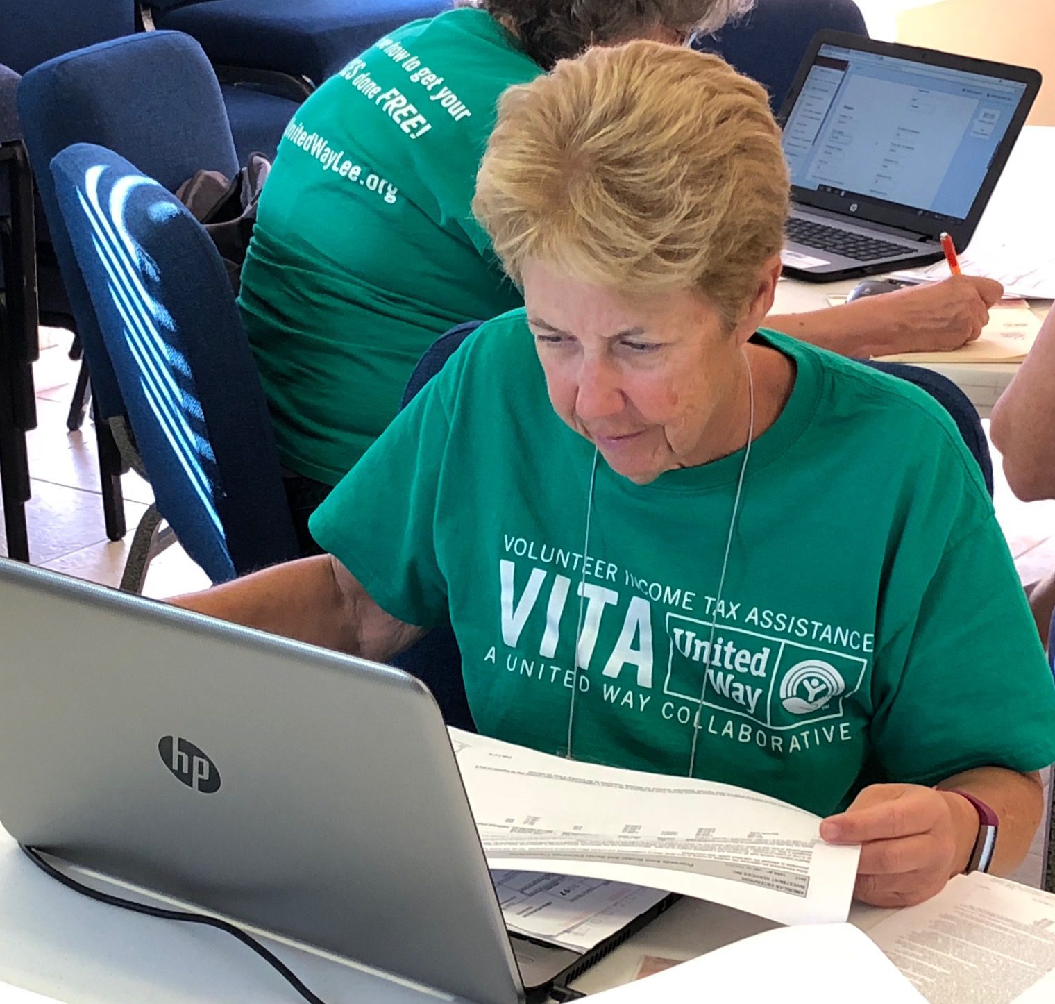 VITA volunteer Rita T. reviewing a return (1) VITA volunteer Rita T. reviewing a return (1)